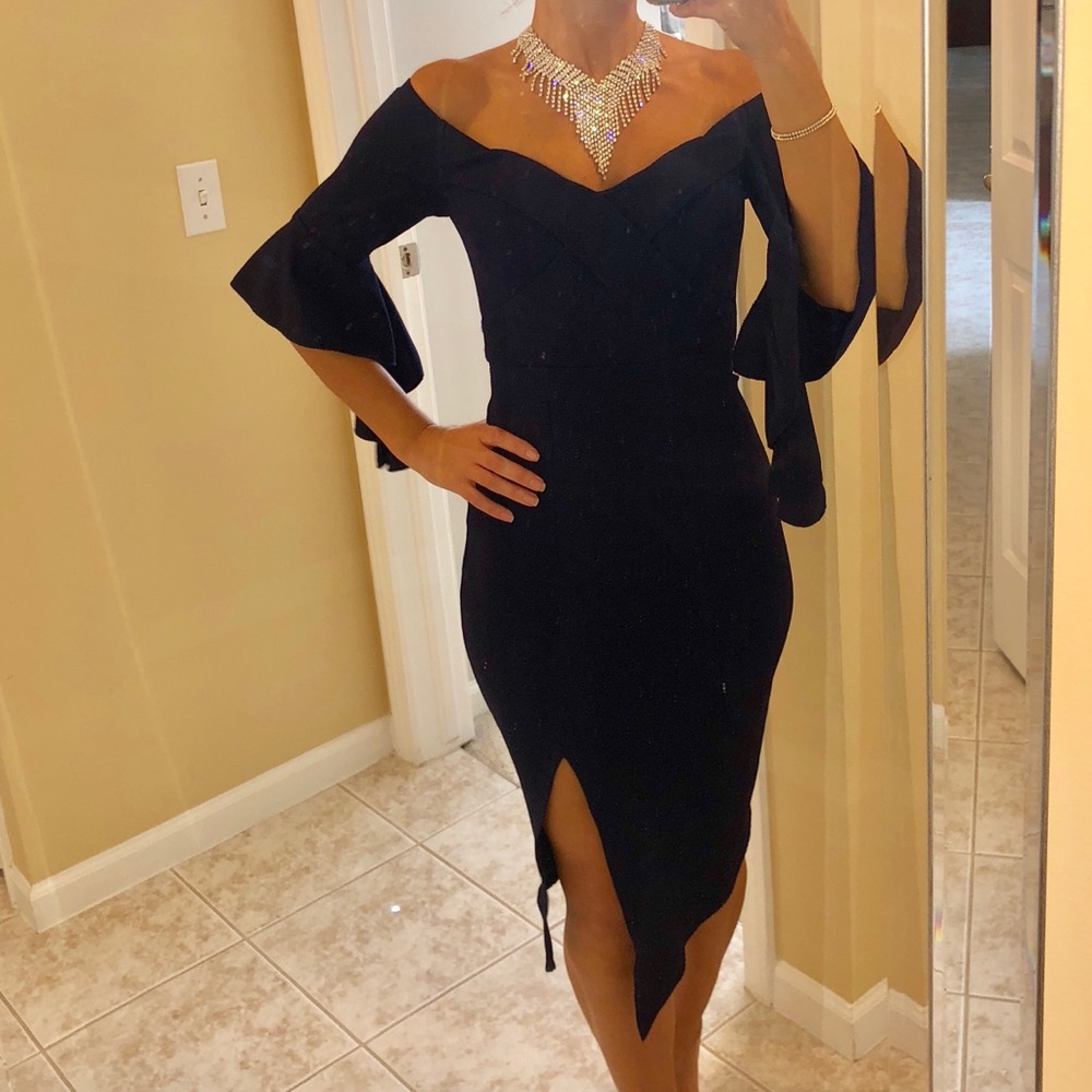 Navy midi dress with flowy sleeves and front slit.